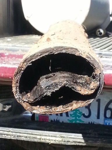 A piece of orangeburg pipe that failed underground and had to be removed.